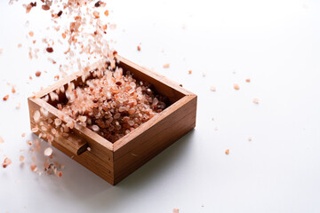 Himalayan pink salt is herb seasoning from himalaya and isolated on white background with copy space