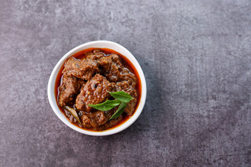 Spicy beef curry. Goan style beef vindaloo. Traditional Indian Lamb or beef curry . spicy Beef curry gravy popular in Kerala Sri Lankan Goa for Appam, Parotta porotta in India.