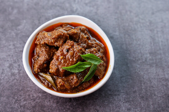 Spicy beef curry. Goan style beef vindaloo. Traditional Indian Lamb or beef curry . spicy Beef curry gravy popular in Kerala Sri Lankan Goa for Appam, Parotta porotta in India.