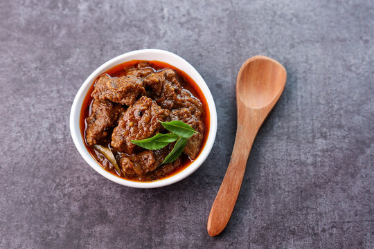 Spicy beef curry. Goan style beef vindaloo. Traditional Indian Lamb or beef curry . spicy Beef curry gravy popular in Kerala Sri Lankan Goa for Appam, Parotta porotta in India.