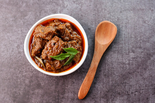 Spicy beef curry. Goan style beef vindaloo. Traditional Indian Lamb or beef curry . spicy Beef curry gravy popular in Kerala Sri Lankan Goa for Appam, Parotta porotta in India.