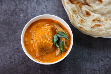 Kerala fish curry coconut milk gravy cooking spicy Goan fish curry. Indian fish curry Bengali fish curry in coconut milk Kolkata India Sri Lanka. Lankan food.