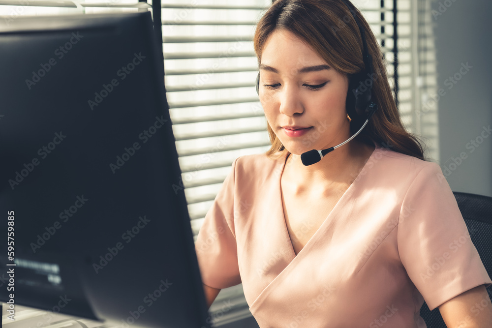 Aufkleber competent female operator working on computer and while talking with clients. concept relevant to bo