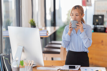 Businesswoman working in the office with paper files Data graph document to find and review cleared...