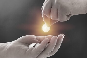 Person hand giving coins money to homeless people