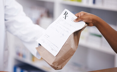 Retail, medicine or pharmacist hands a person a bag in drugstore with healthcare prescription...
