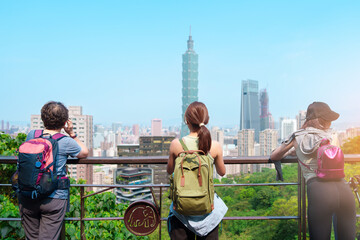 traveler visiting in Taiwan, Tourist looking Taipei City during sightseeing and hiking at Elephant Mountain or Xiangshan, landmark and popular attractions. Asia Travel, vacation and Trip concept