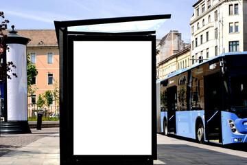 bus shelter blank ad panel. billboard display. empty white lightbox sign at busstop. glass structure. transit station. mockup base. urban street with traffic. park setting. bus shelter advertising