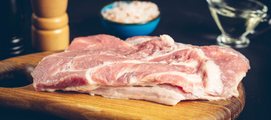 fresh meat with seasonings before cooking