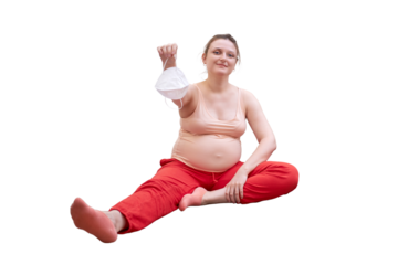 Fitness at home during pregnancy and the removed face mask, isolated on a white background. Pregnant woman at a sports training session with a medical mask in hand