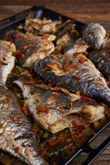 Oven cooked bream in a tray