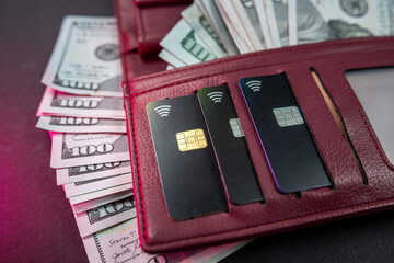top view of wallet with money and credit cards isolated on plain background.