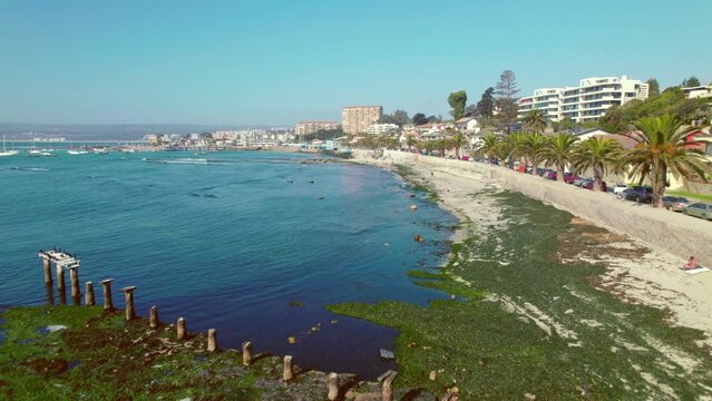 Aerial Drone Fly Above Pejerrey Beach Travel Destination in Algarrobo Chile Blue Calm Water with Relaxing Atmosphere
