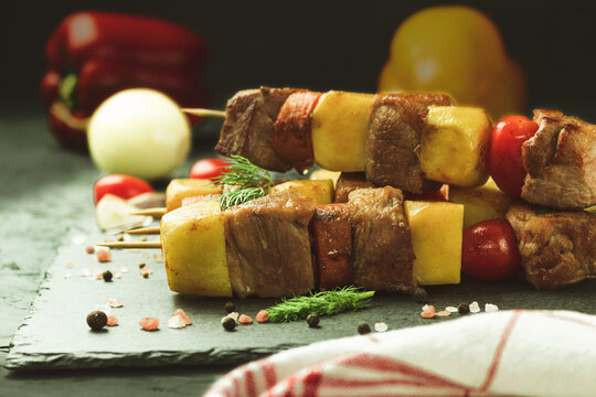 A dish of meat with potatoes and vegetables