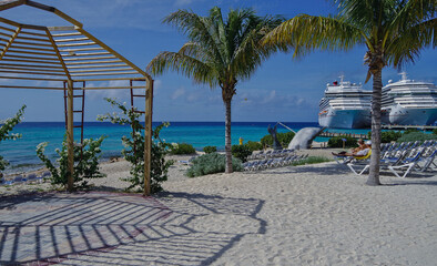 Beautiful sandy beaches and palm trees on tropical island in the Caribbean sea for summer cruise vacation
