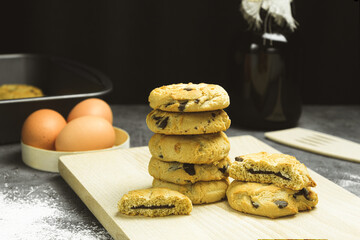 Freshly baked cookies with chocolate on a baking sheet
