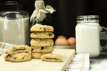 Freshly baked cookies with chocolate on a baking sheet