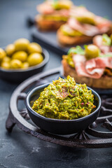 Avocado spread, guacamole with fried bread, substitute for toast and olives