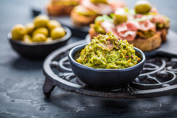 Avocado spread, guacamole with fried bread, substitute for toast and olives