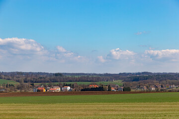 Fototapeta na wymiar Agricultural fields and forests. Spring landscape, Czech Republic