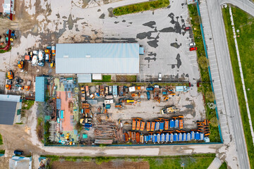 Drone view of factory and trucks