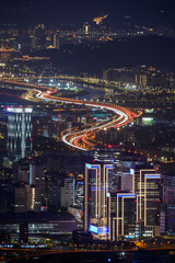 Fantasy blue sky. The vibrant and bustling night scene of Taipei City. Night view of the city surrounded by mountains is hazy and dreamy. Dajianshan, Taiwan