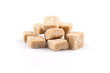 Heap brown sugar cubes isolated