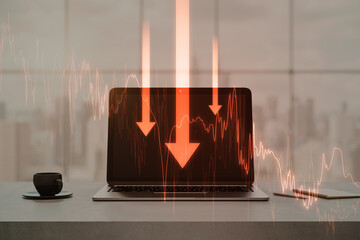 Close up of laptop on desktop with coffee cup, supplies and red business chart and arrows on blurry window with city view background. Crisis, recession and financial failure concept. Double exposure.
