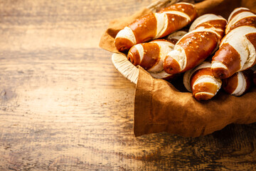 Pretzel sticks and pretzel rolls, Bavarian lye bun with salt in a basket
