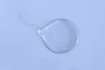 Trasparent smear in shape of spermatozoid on color background.Concept for fertilization