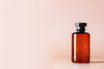 Shampoo, bath gel or lotion cosmetic bottle at nude background. Minimalist aesthetic concept