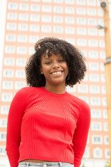 Fototapeta premium Happy Afro woman in city