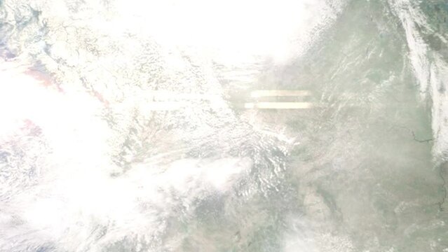 Earth zoom in from outer space to city. Zooming on Kalispell, Montana, USA. The animation continues by zoom out through clouds and atmosphere into space. Images from NASA