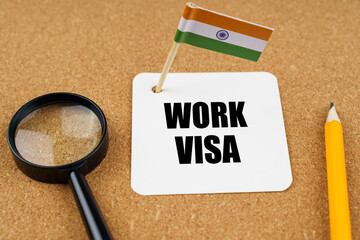 On the table is the flag of India, a pencil, a magnifying glass and a sheet of paper with the...