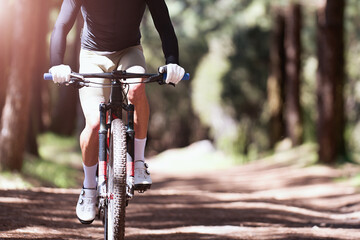 Mountain biking man riding on bike in summer mountains forest landscape
