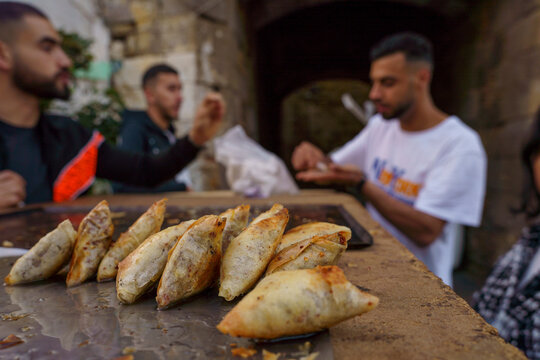 buying briouats to break the Ramadan fast, Asilah, morocco, africa