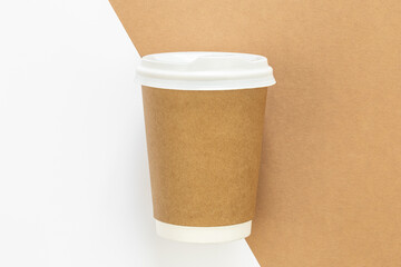 Craft paper coffee cup, flat lay, close up.