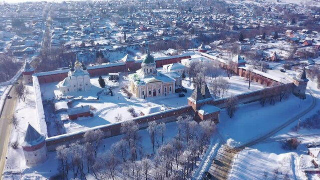 Scenic aerial view of architectural complex of medieval fortified Zaraysk Kremlin on sunny winter day, Russia 