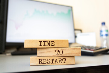 Wooden blocks with words 'TIME TO RESTART'. Business concept