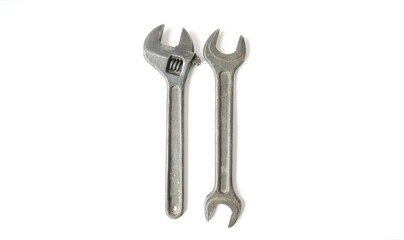 On a white isolated background, two different wrenches of different sizes.  Concept design and hand tools, plumbing work.  Flat lay, top view, closeup,