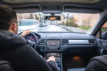 Hands on the wheel when driving at high speed from inside the car.