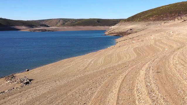 Drought in the Ricobayo reservoir, province of Zamora, Spain. The low water level is due to the use of water to produce hydroelectric power.