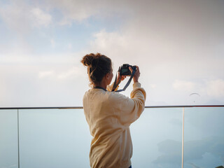 woman enjoys the view from the viewpont over Oludeniz, Turkey.