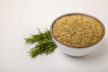 Dried rosemary and branches of fresh rosemary on a white texture background. Spicy spices. Seasoning for meat and fish. Cooking concept. RECEPT. Close-up. place for text.