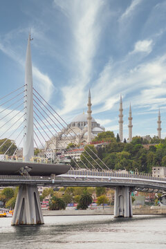 Day shot of Golden Horn Metro Bridge, or Halic Bridge, overlapping Suleymaniye Mosque, Istanbul, Turkey