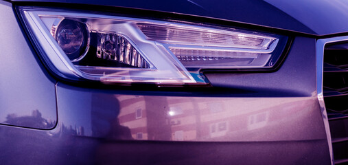 Obraz na płótnie Canvas close-up headlight of modern prestigious car