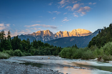 Stream of Taugl River during Sunrise with view of the Alps near Salzburg, Austria, Europe