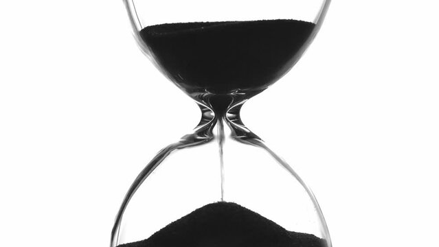 Hourglass on white background silhouette, macro, close-up