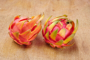 Healthy dragon fruits or pitaya isolated on texture background.