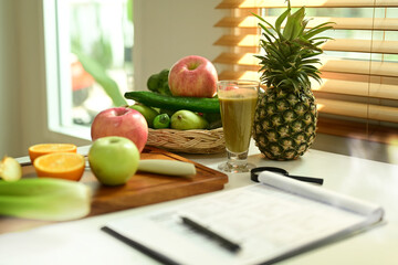Fruit and vegetable on chopping board with Nutrition Facts on table.
